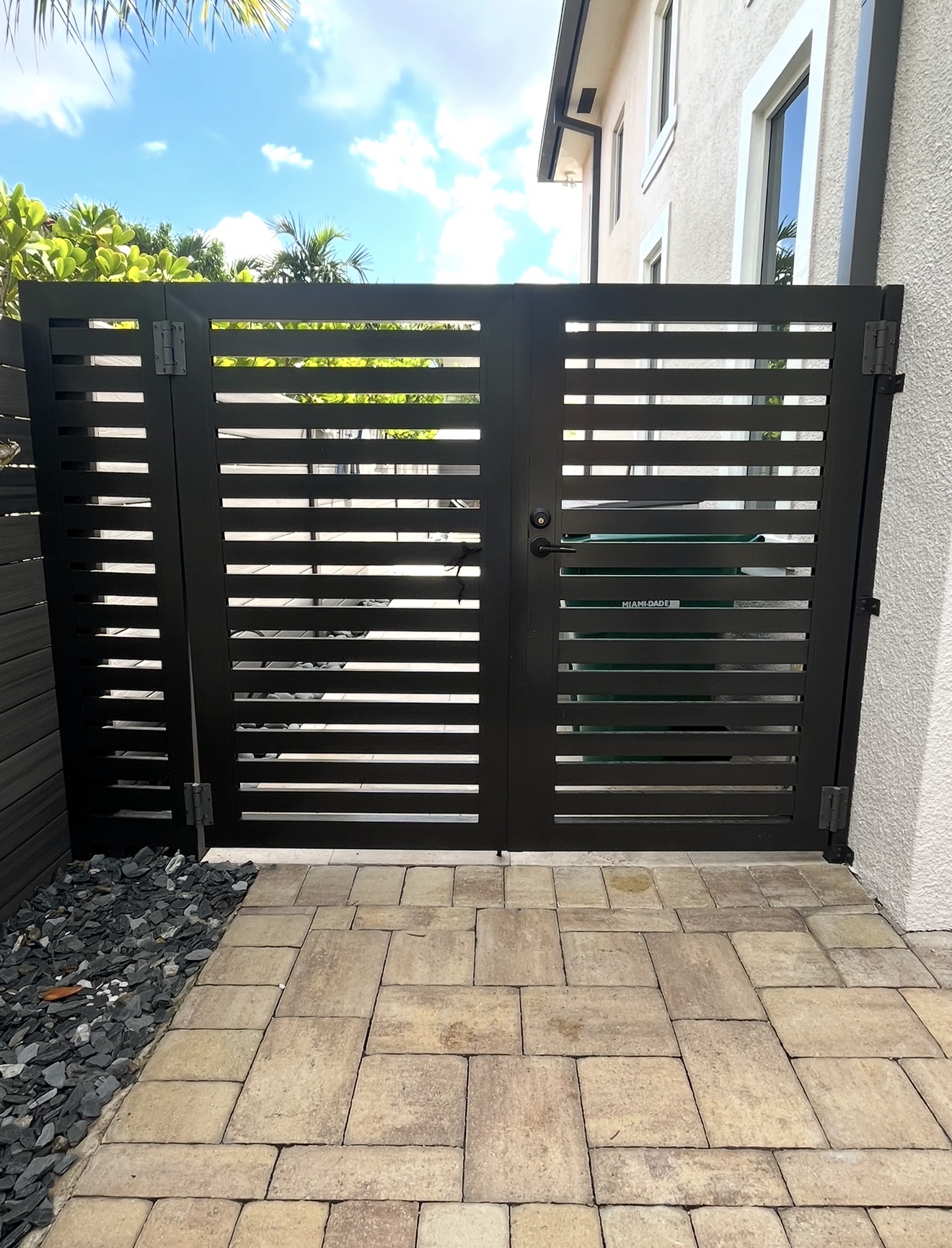 Modern black horizontal slat pedestrian gate