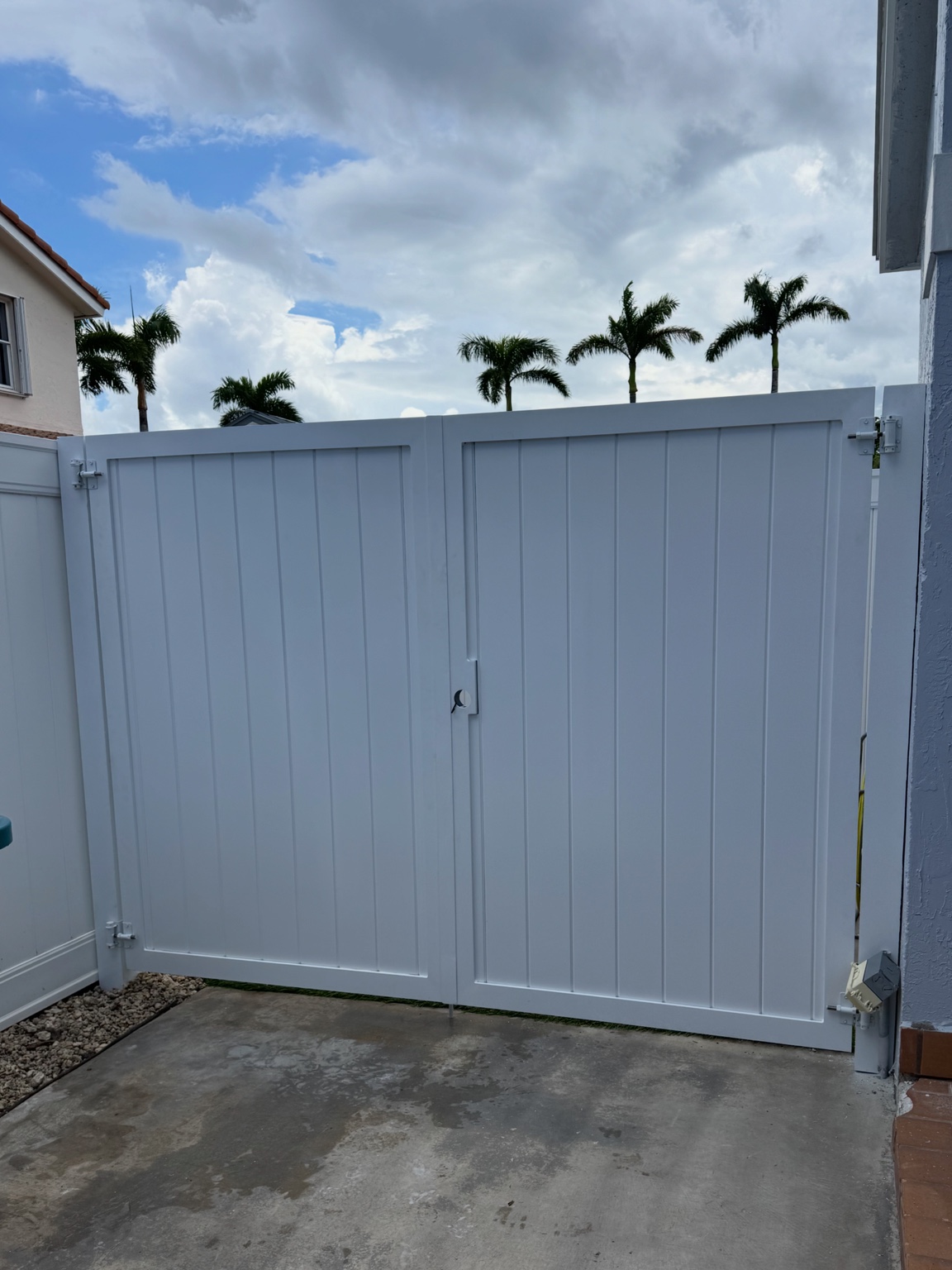 White solid panel driveway gate