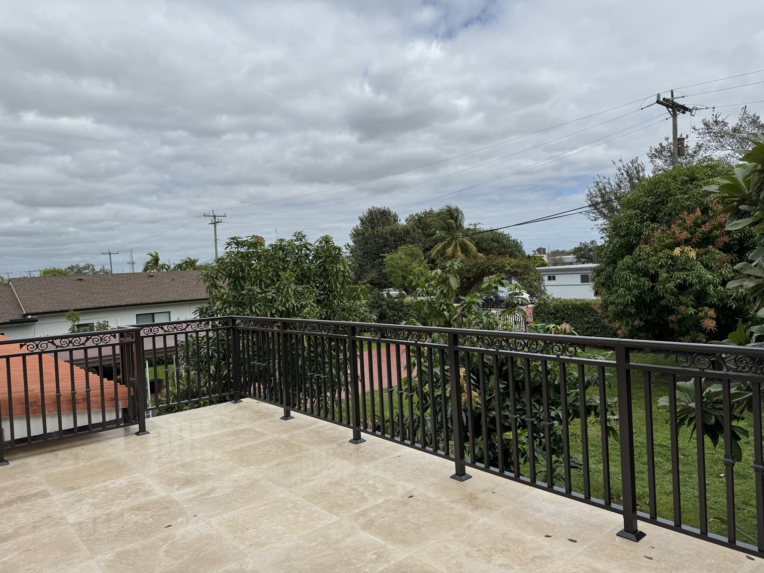 Decorative terrace railing with scrollwork