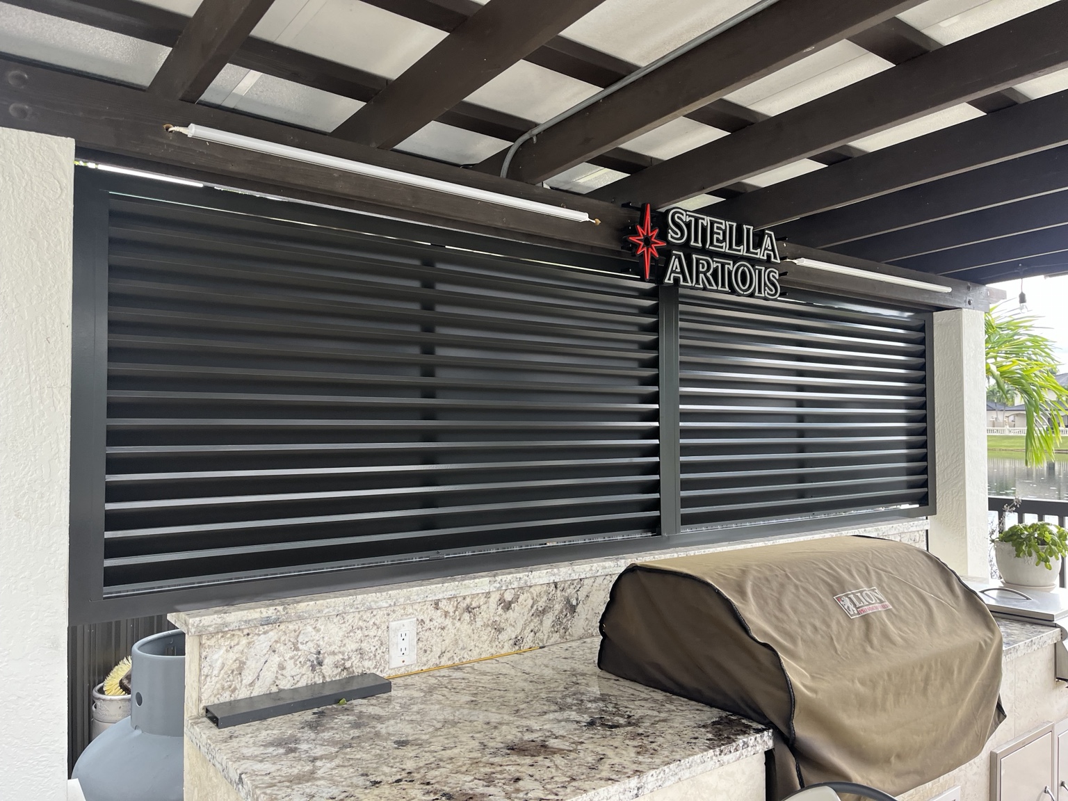 Black horizontal slat outdoor enclosure
