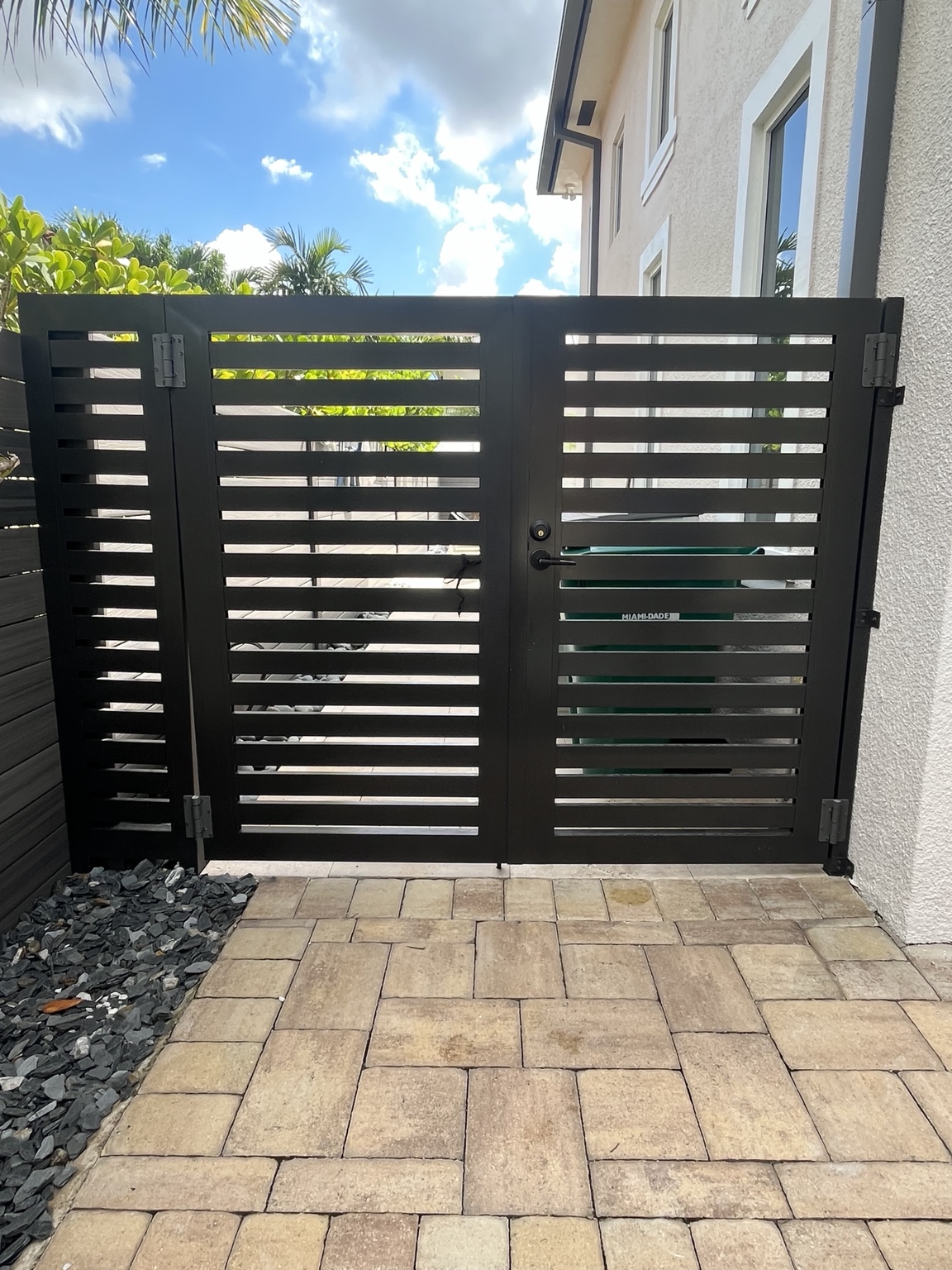 Black horizontal slat double gate