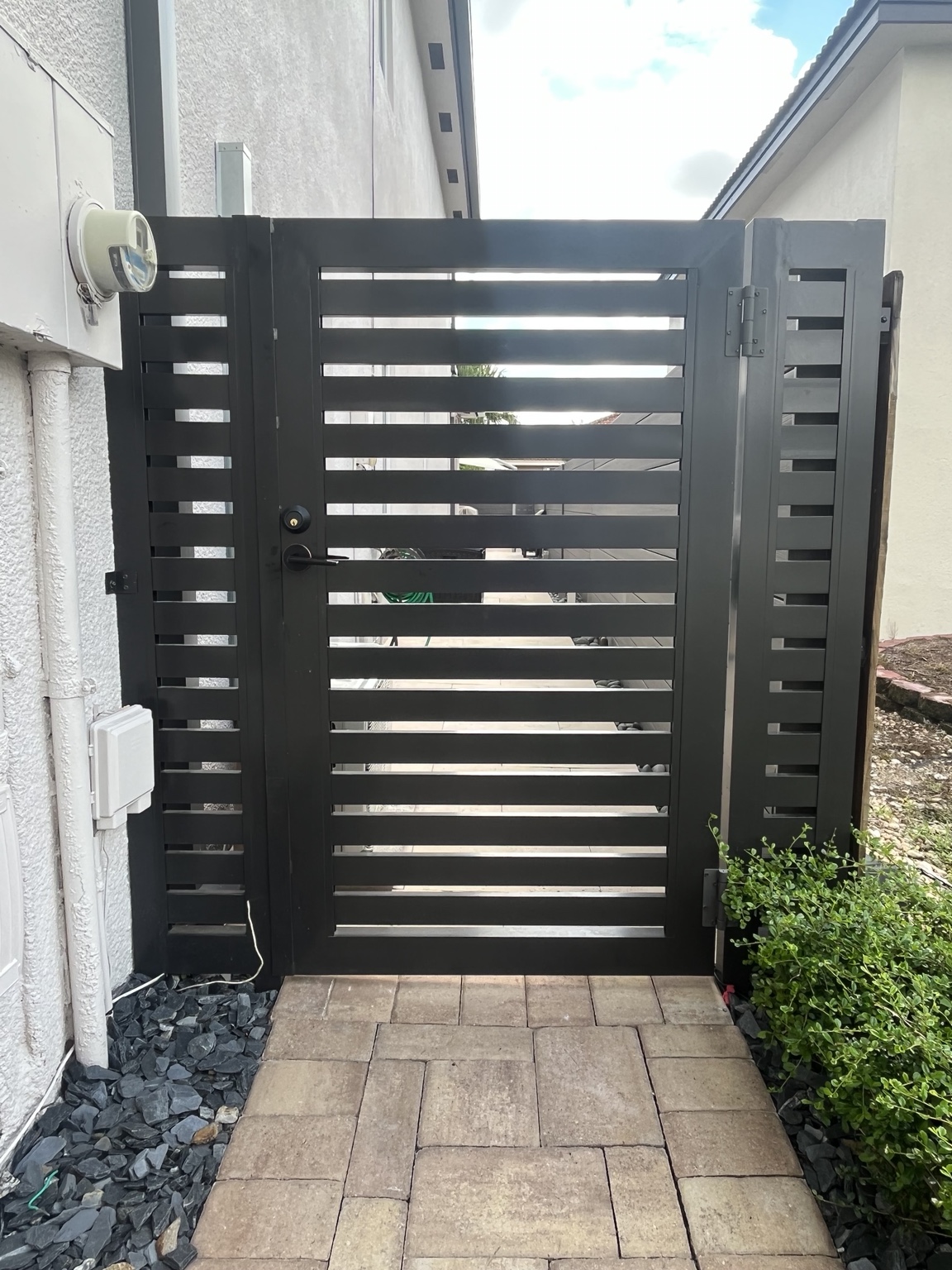 Black horizontal slat pedestrian gate