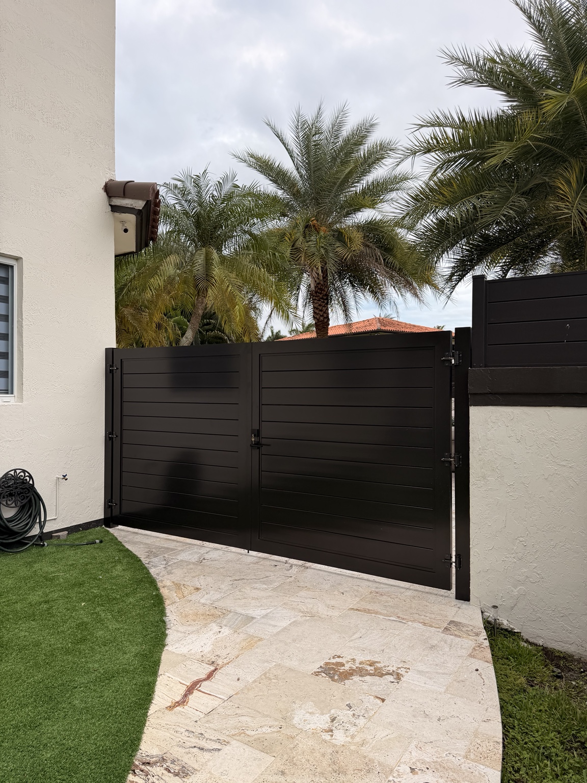Custom black double swing driveway gate