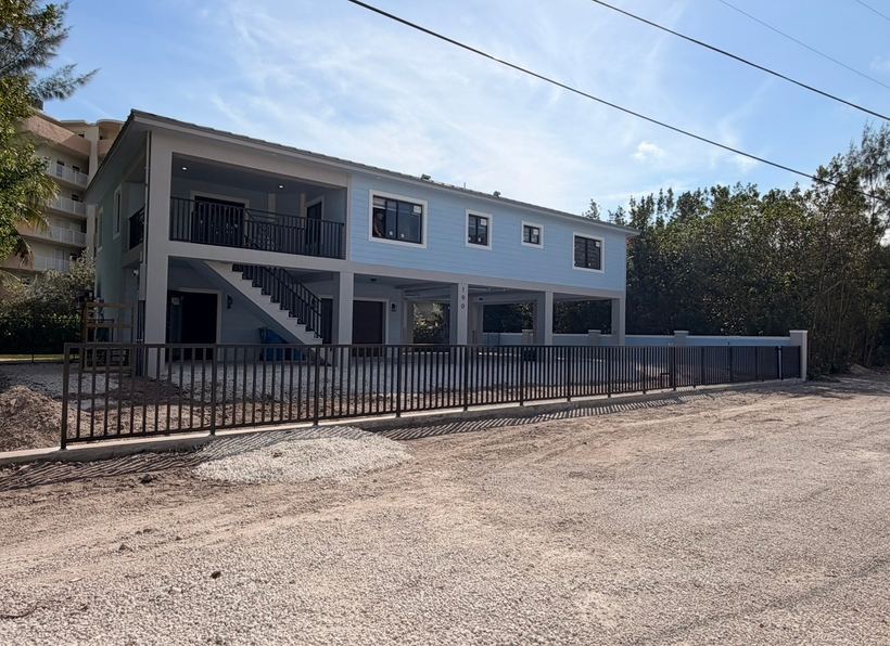 Vertical picket aluminum perimeter fence at an apartment building
