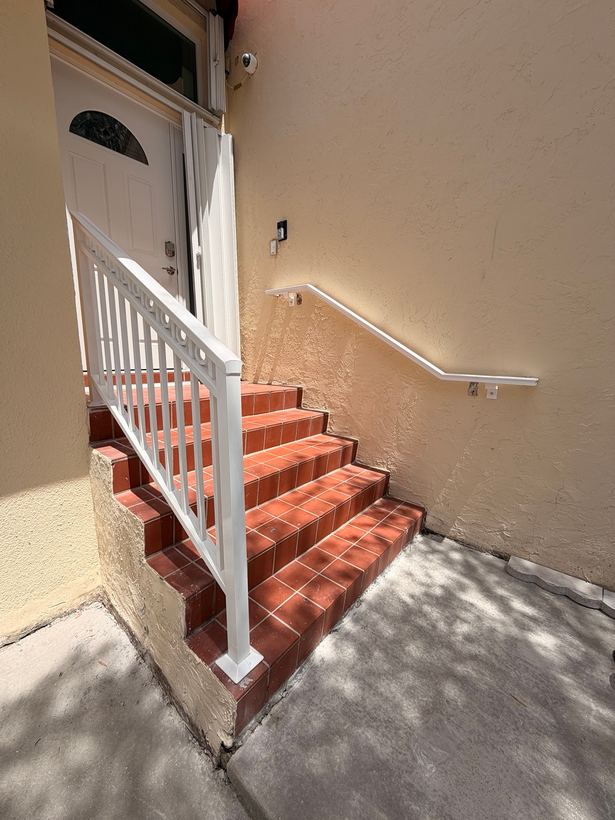 White custom stair railing and wall handrail