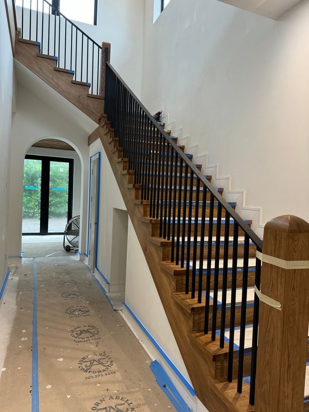 Modern interior staircase railing with vertical pickets